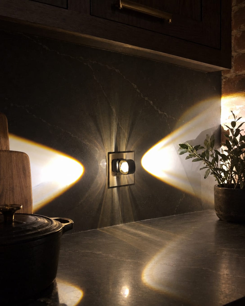 Aoraglow lighting a dark kitchen at night with a warm wash of light on the wall